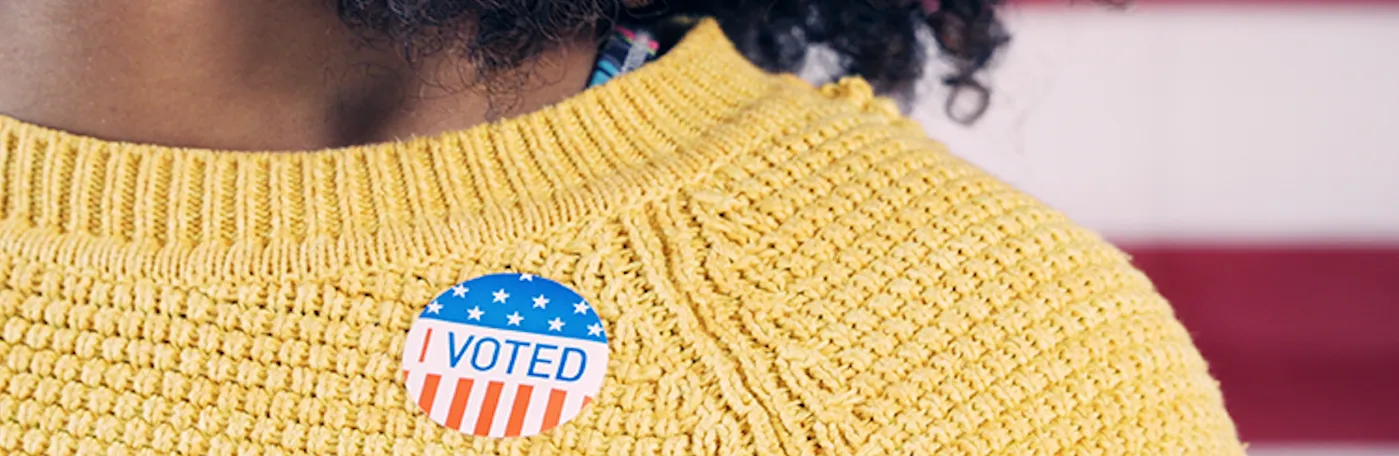 Person wearing an "I Voted" sticker